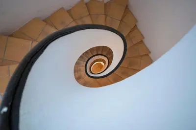 a spiral staircase in a room with a car at Ambrosio Flats Valencia - El Mercat in Valencia