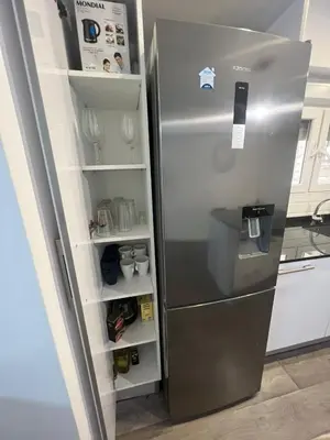 a refrigerator with its door open in a kitchen at Sweet Home in Valencia