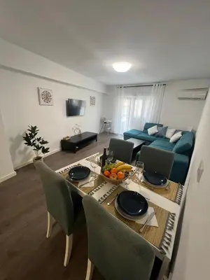 a living room with a table and a couch at Sweet Home in Valencia