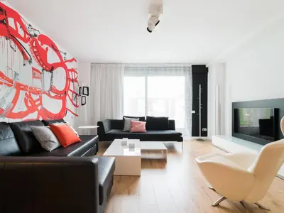 a living room with a couch and a tv at Flat El Porto - Valencia in Valencia