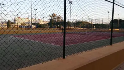 a tennis court with two tennis courts at Apartamento Con Preciosas Vistas Al Mar,WIFI y piscina de temporada in Canet de Berenguer