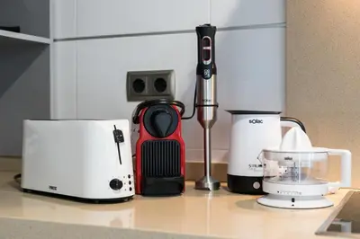 a group of appliances sitting on a kitchen counter at ApartUP Patacona Terrace Duplex II in Valencia