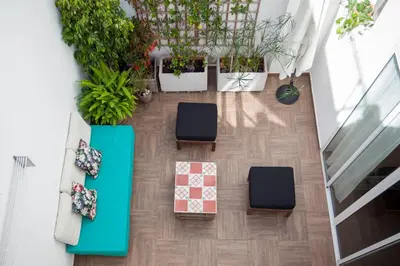 an overhead view of a living room with furniture and plants at Family ARTpartment in Valencia