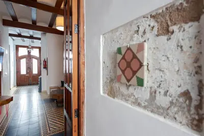 a hallway with a painting on the wall at Family ARTpartment in Valencia