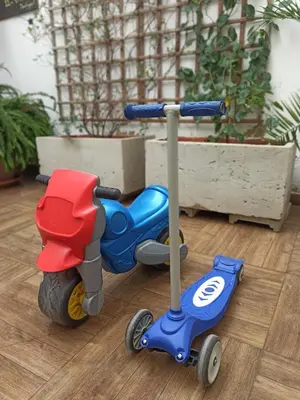 a toy scooter is sitting on a floor at Family ARTpartment in Valencia