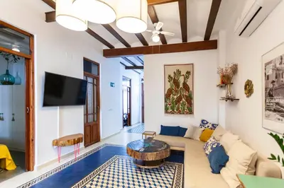 a living room with a couch and a table at Family ARTpartment in Valencia