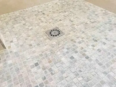 a tile floor with a drain in the middle at Reus, Lovely Flat Close to Center in Valencia