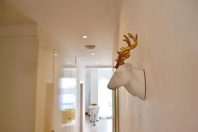 a deer head on the wall of a room at Hola Valencia - Holiday Apartments in Valencia