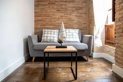 a living room with a couch and a table at My Loft 4 You Ruzafa Style III in Valencia
