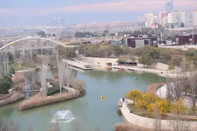 a river with a bridge in a city at River Park Valencia in Valencia