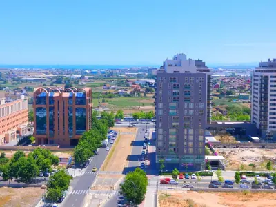an aerial view of a city with tall buildings at Oceanográfico Apartments in Valencia