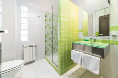 a bathroom with a sink and a toilet at Travel Habitat Ático Ciutat Vella. in Valencia