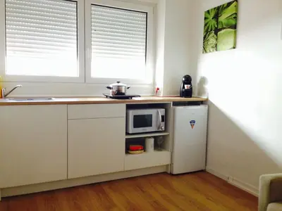 a kitchen with a microwave and a refrigerator at Valencian Dreams in Valencia