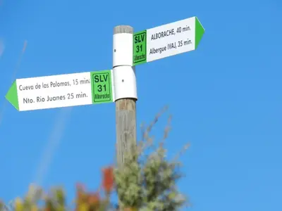 a street sign with two green and white street signs at Casa Esperanza in Alborache