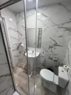 a bathroom with a toilet and a sink at Hospederia del Pilar in Valencia