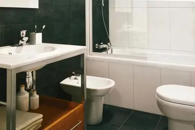 a bathroom with a sink and a toilet and a tub at Sun Apartament Valencia @ City Arts & Sciences + Parking in Valencia