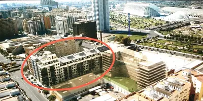a red circle on top of a building in a city at Sun Apartament Valencia @ City Arts & Sciences + Parking in Valencia