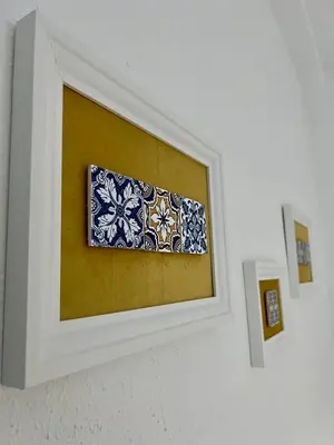 a picture in a white frame on a wall at Big spacious penthouse next to the sea in Valencia