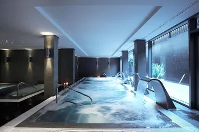a hot tub in the middle of a building at Primus Valencia in Valencia