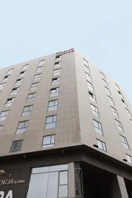 a tall building with windows on the top of it at Primus Valencia in Valencia