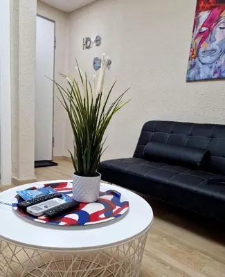 a living room with a table and a couch at Vive Valencia con playa y metro cerca in Valencia