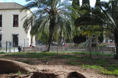 a park with palm trees and a playground at La Seda Stay in Valencia