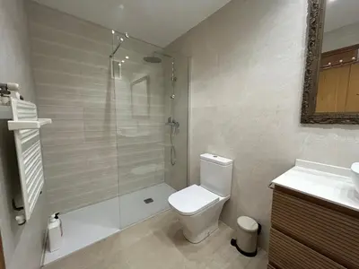 a bathroom with a toilet and a bath tub at La Seda Stay in Valencia