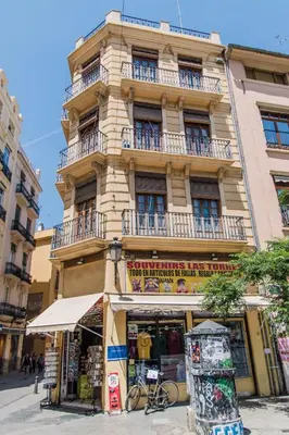 a tall building with balconies on a city street at Lovely Apartment! in Valencia