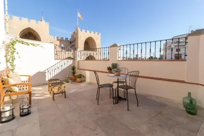 a patio with chairs and a table on a balcony at Lovely Apartment! in Valencia