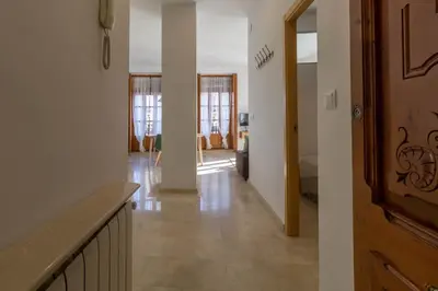 a hallway with a hallway leading to a living room at Lovely Apartment! in Valencia