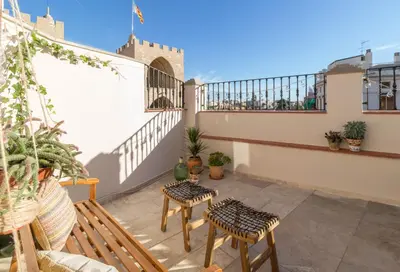 a balcony with tables and chairs on a building at Lovely Apartment! in Valencia