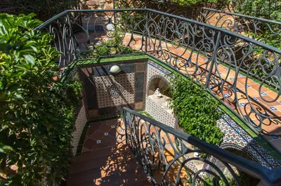 an overhead view of a metal staircase with plants at Apartamentos Gaudi Style in Náquera
