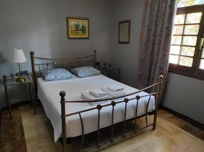 a bedroom with a bed with towels on it at Apartamentos Gaudi Style in Náquera