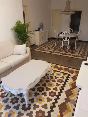 a living room with a couch and a table at Domus Valencia Apartamentos centro frente a Torres de Serrano in Valencia