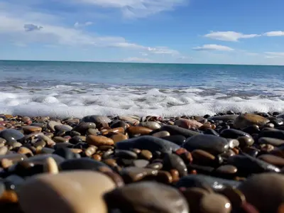 a group of rocks on a beach near the ocean at Preciosas vistas al mar in Moncófar