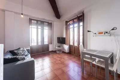 a living room with a couch and a table at Cool Central Market in Valencia