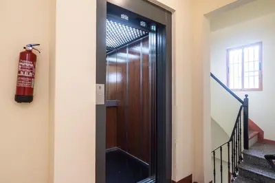 a fire extinguisher next to a door in a building at Cool Central Market in Valencia