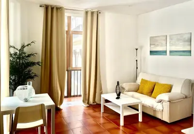 a living room with a couch and a table at Cool Central Market in Valencia