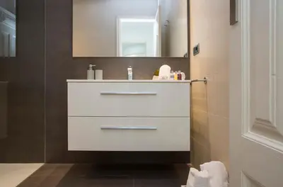 a bathroom with a white sink and a mirror at SingularStays Santa Clara in Valencia