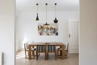 a dining room with a table and chairs at SingularStays Santa Clara in Valencia