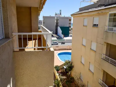 a view from the balcony of a building with a swimming pool at Apartamentos Canet de Berenguer 3000 in Canet de Berenguer