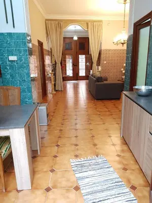a large living room with a table and a couch at Casual House Valencia in Valencia