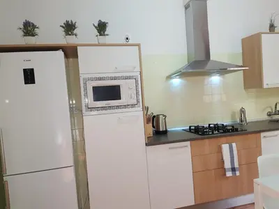 a kitchen with a microwave on top of a refrigerator at Casual House Valencia in Valencia