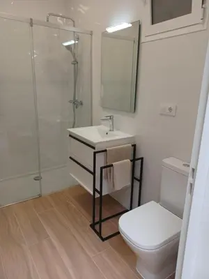 a bathroom with a sink and a shower and a toilet at Casual House Valencia in Valencia