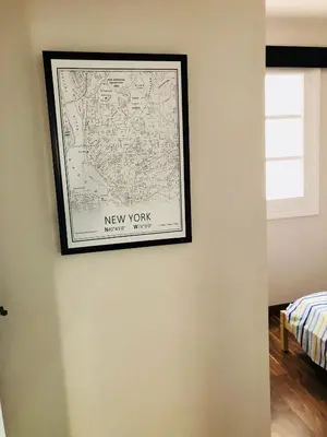 a picture of a new york map on a wall at Mar & City Apartment in Valencia