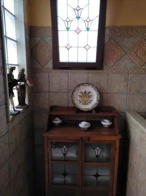 a room with a table and a stained glass window at Precioso chalet en la playa de Tavernes de la Valldigna in Tavernes de Valldigna