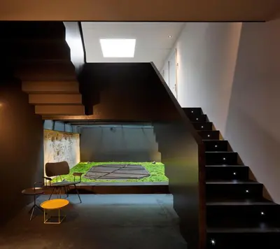 a room with a bed and a staircase at Caro Hotel in Valencia