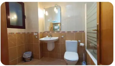 a bathroom with a toilet and a sink at Apartamento Cerca De Valencia in Riba-Roja De Turia