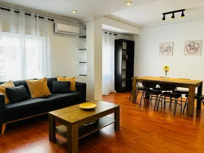 a living room with a couch and a table at Travel Habitat Mestalla in Valencia