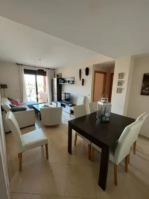 a large swimming pool with palm trees and buildings at WONDERFUL APARTMENT IN CANET DE BERENGUER. VALENCIA in Valencia